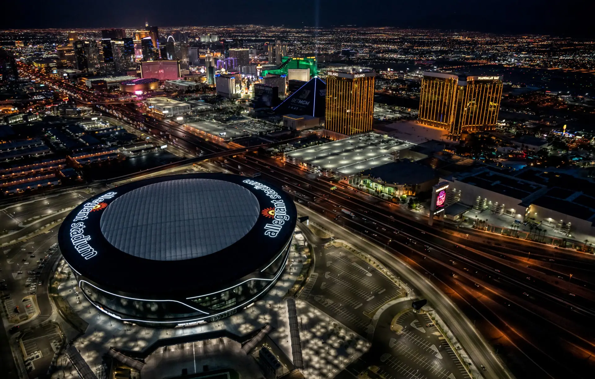 Nighttime aerial view of the brilliantly designed futuristic ETFE roof.