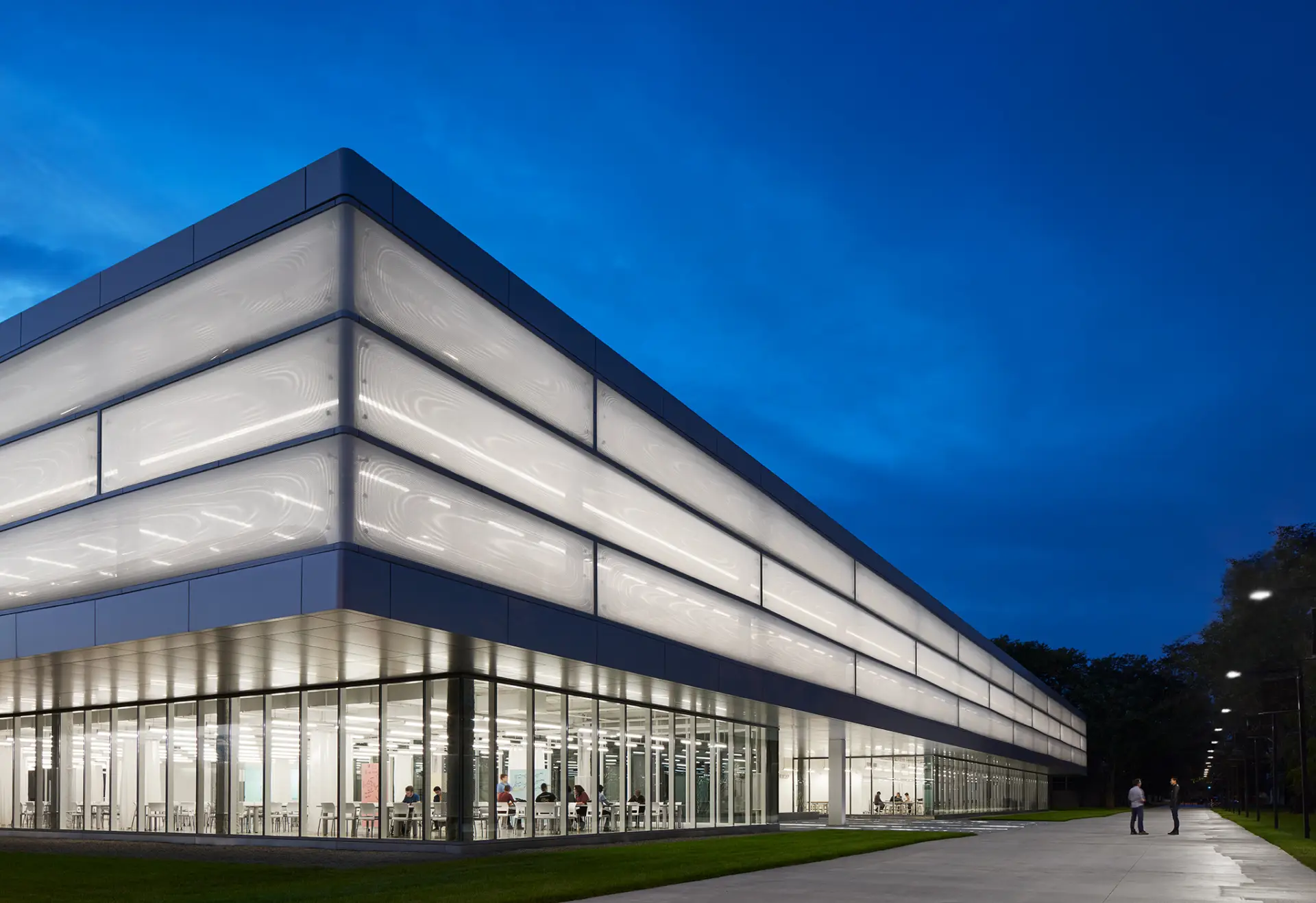 Exterior view of the  innovative Texlon® ETFE facade illuminated at night.
