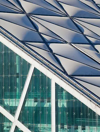 Four buildings enclosed by an roofing envelope comprising of Texlon® ETFE, glass and steel structure.