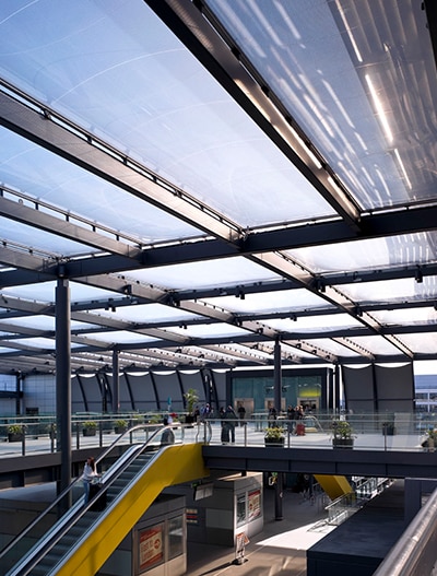 This tiered ETFE roof canopy offers protection to passengers arriving at Gatwick Airport’s North Terminal Interchange.
