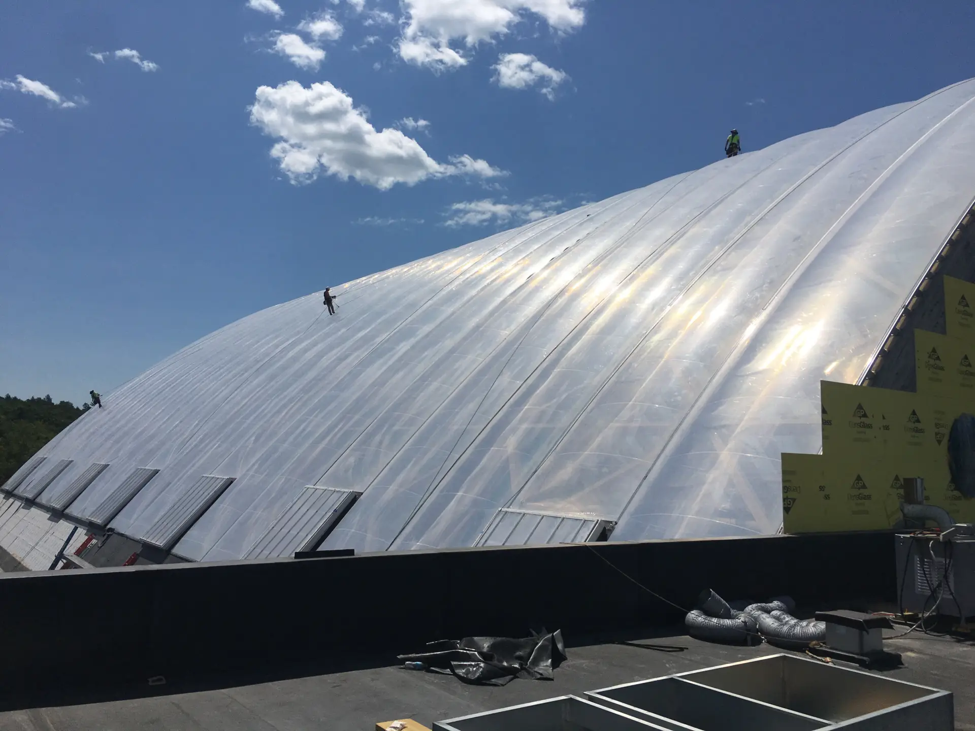 One of our installers shows the magnitude of the ETFE cushions enclosing the waterpark.