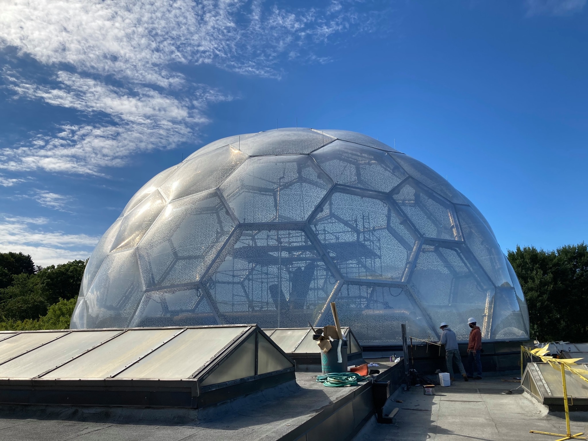 The transparent ETFE dome during cushion installation.