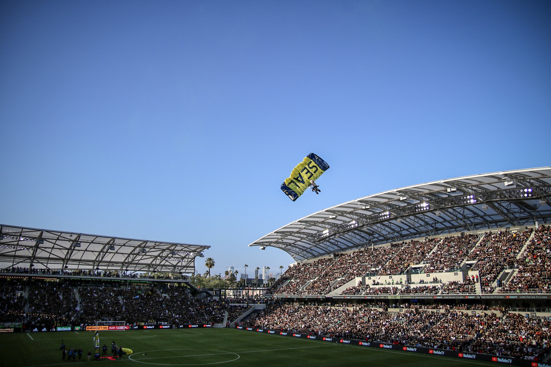 View of the Texlon® ETFE canopies as part of the SEAL team lands before a game opener.