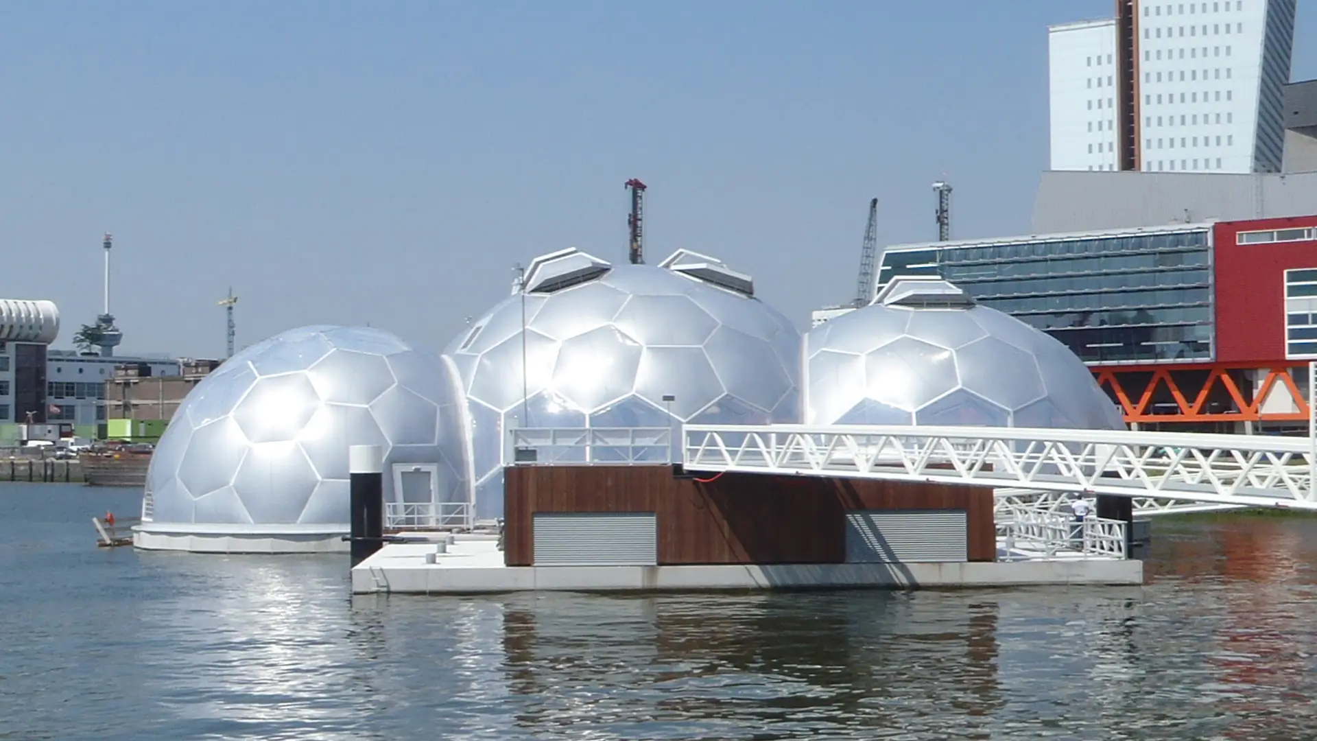 Designed by Deltasync and Public Domain Architects, the domes of the floating pavilion in Rotterdam are clad in Texlon® ETFE by Vector Foiltec