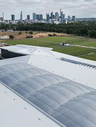 The large ETFE cushions cover an indoor football field and a multipurpose hall.